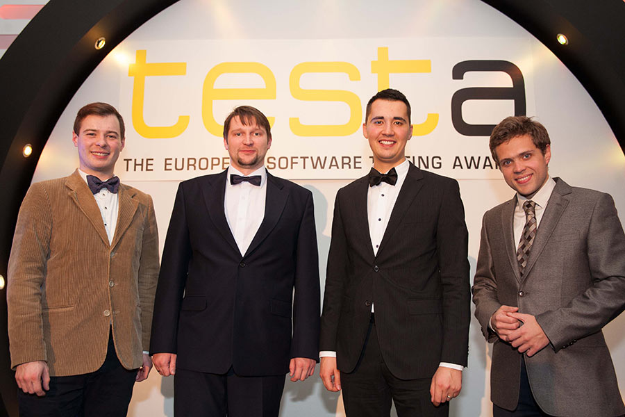 Four men in suits at testa THE EUROPEAN SOFTWARE TESTING AWARDS event