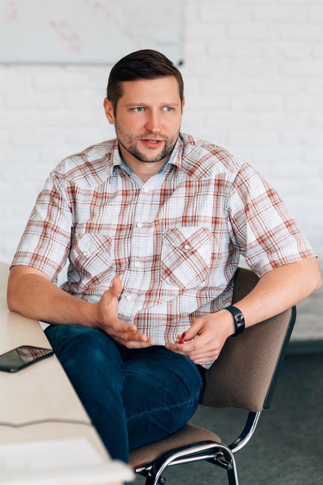 Team member speaking during a meeting in an office setting