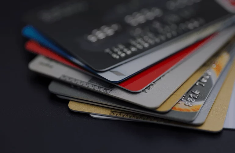 Close-up of stacked payment cards, representing customer billing and payment data management