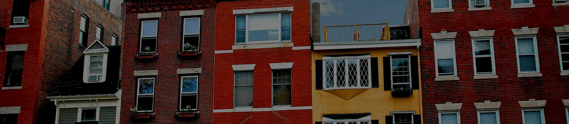 Row of brick residential buildings in Boston urban neighborhood skyline