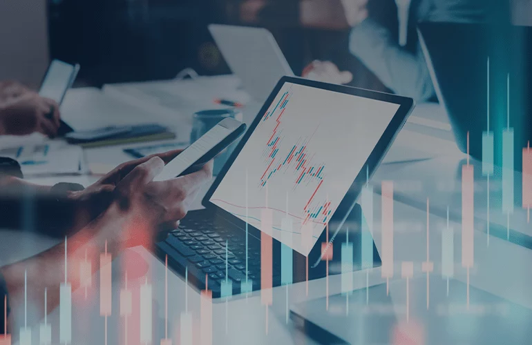 Tablet displaying financial charts during a business meeting about ERP system performance