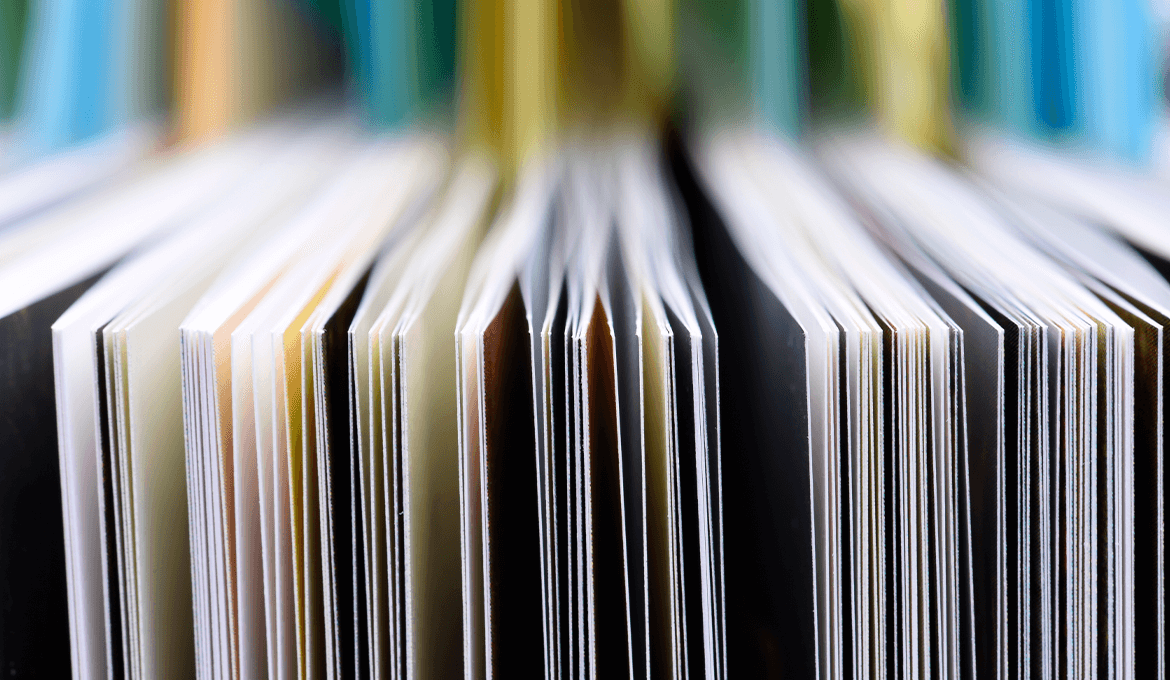 Close-up of stacked document pages representing API contracts and service interface validation