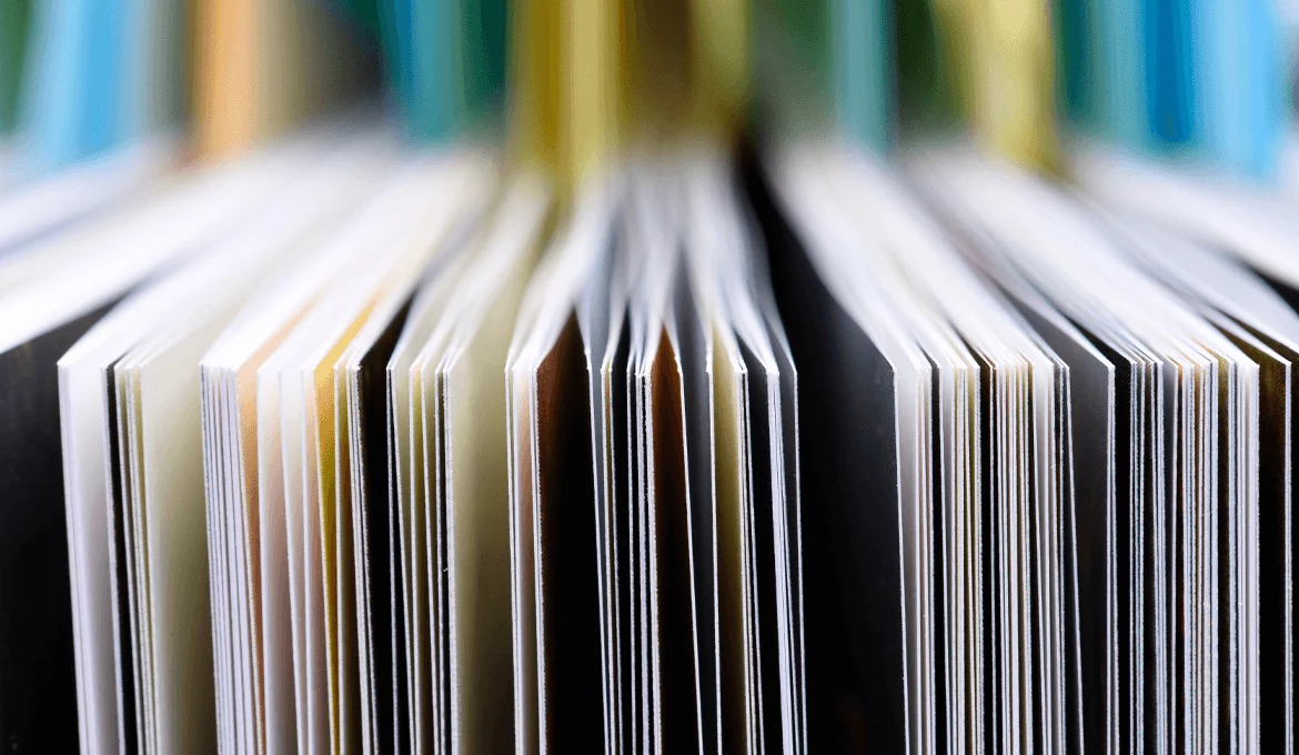 Close-up of stacked document pages representing API contracts and service interface validation