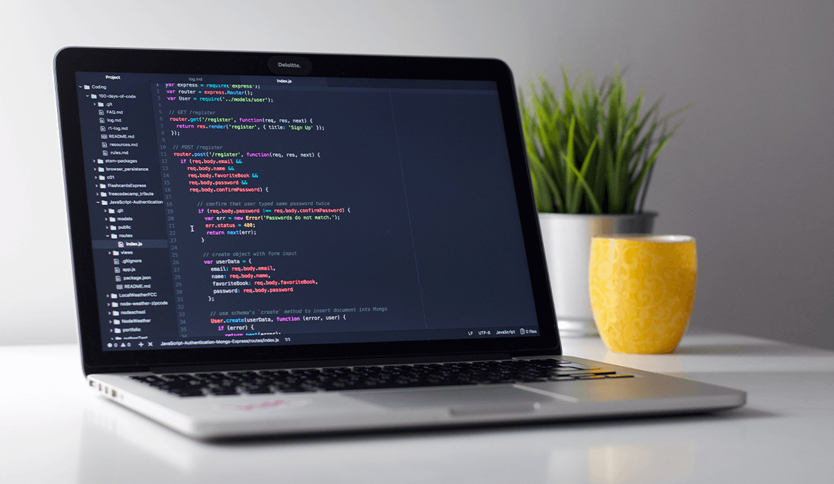 Laptop displaying source code for unit testing on a modern development workspace
