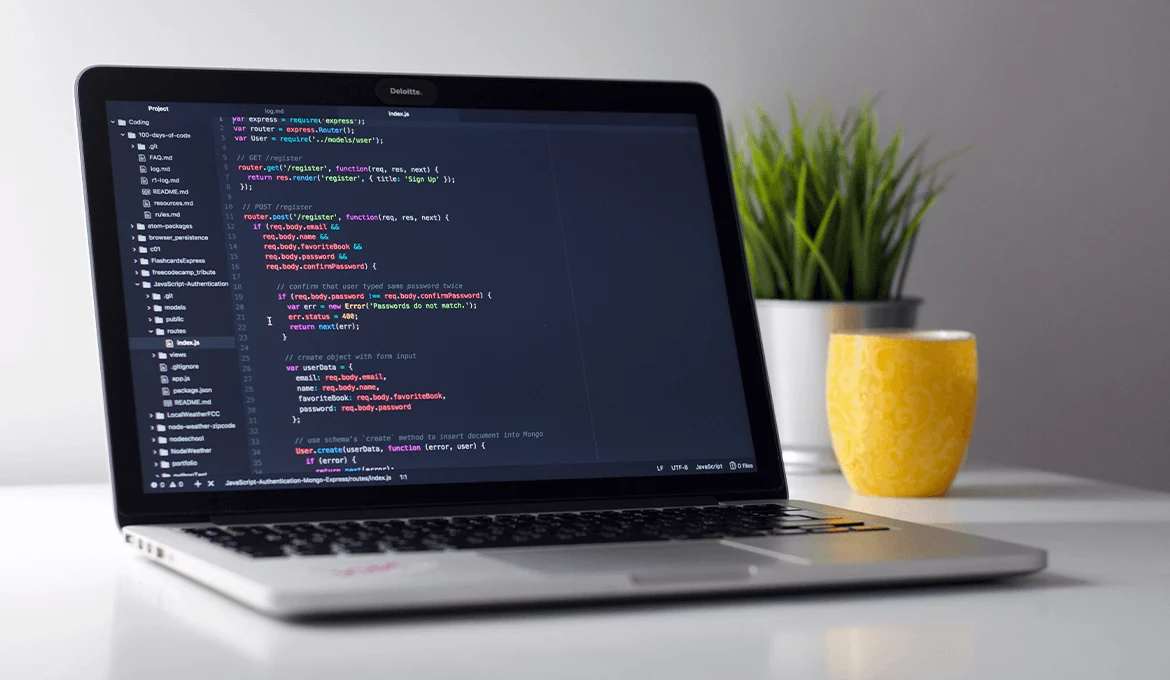 Laptop displaying source code for unit testing on a modern development workspace