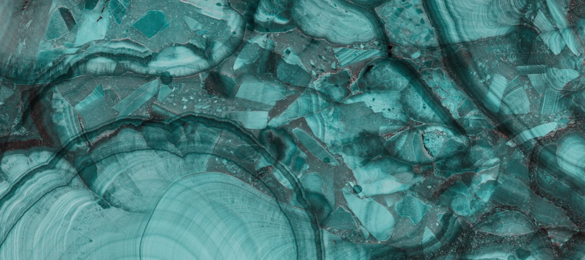 Abstract teal mineral texture background with layered patterns for managed QA services page