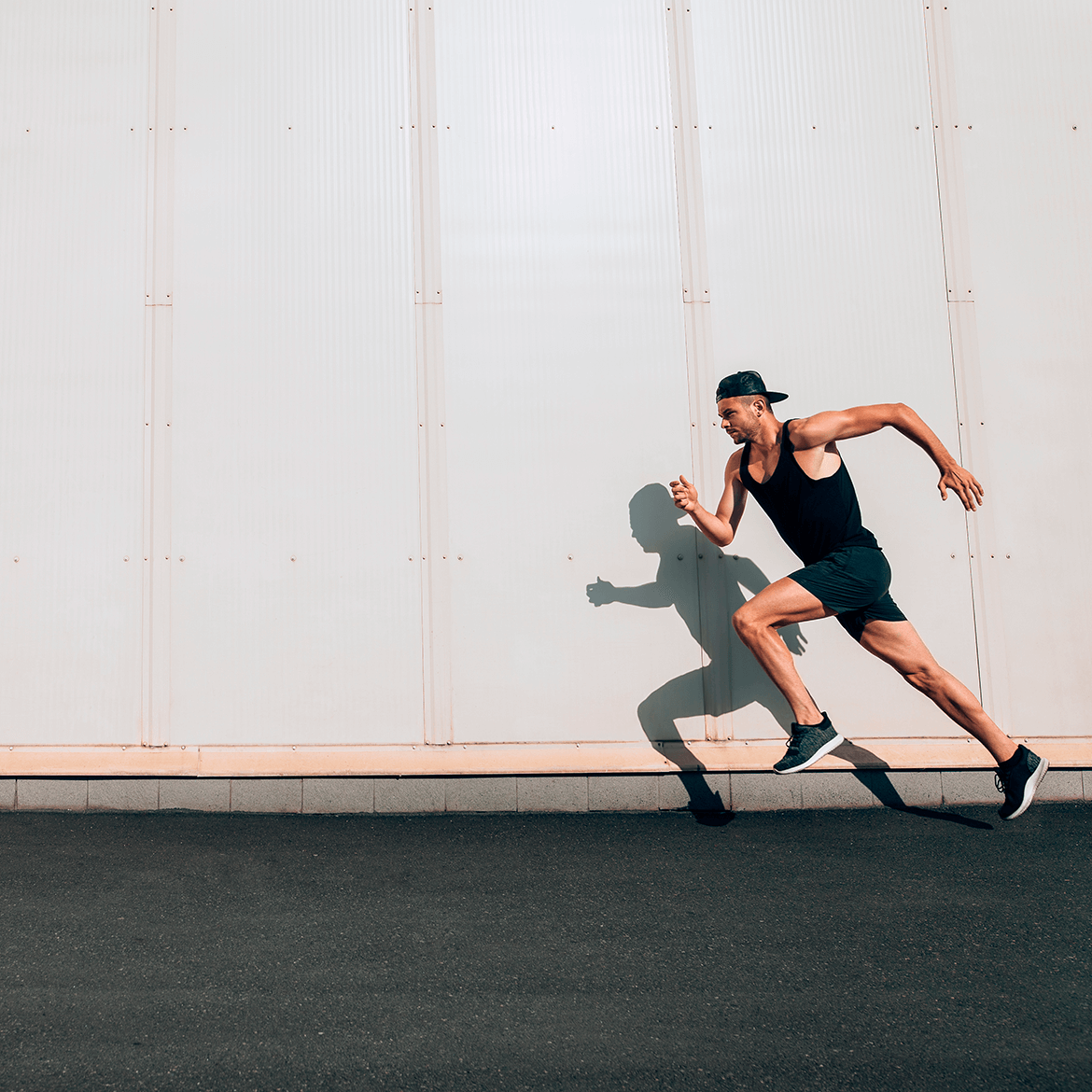 Athlete sprinting beside a wall, representing fast and reliable software functionality