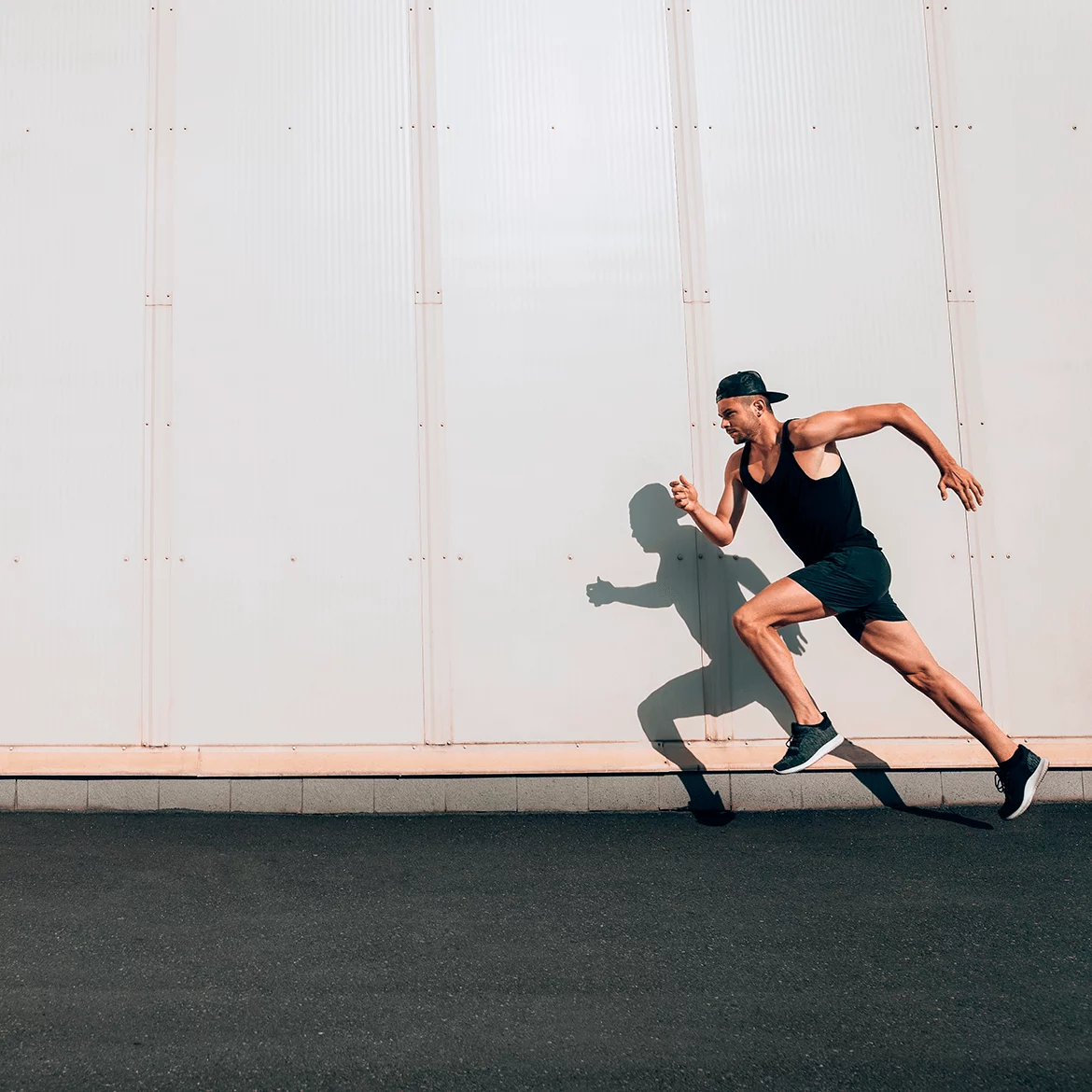 Athlete sprinting beside a wall, representing fast and reliable software functionality