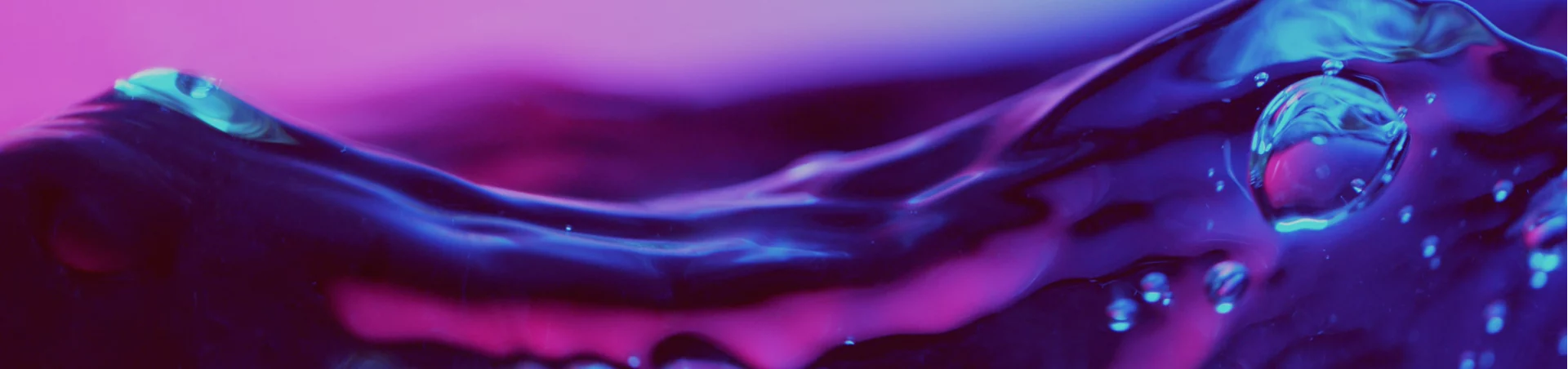 Abstract neon liquid background representing dynamic CRM testing expertise across industries