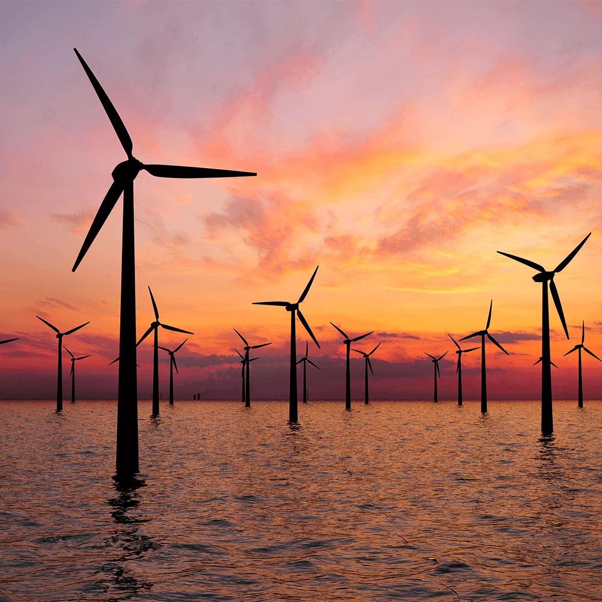 Offshore wind turbines at sunset, symbolizing automated functionality and reliable performance
