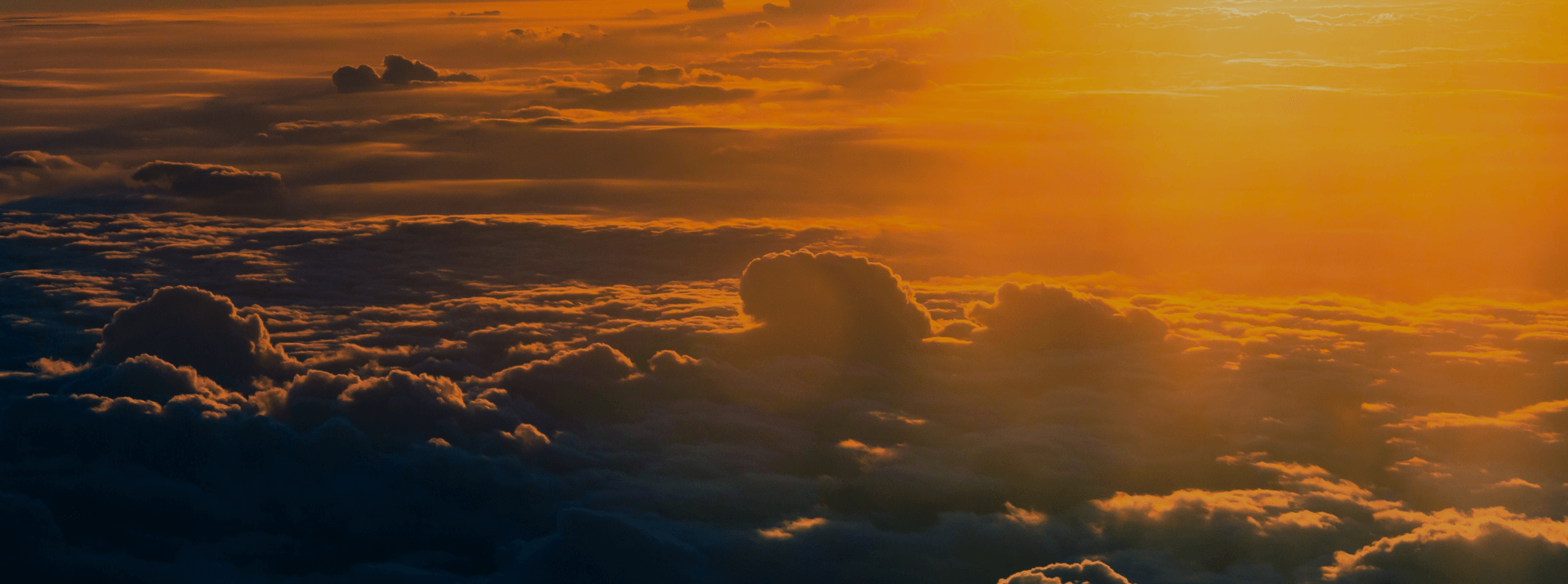 Sunlight over layered clouds, representing scalable cloud testing and automated quality assurance
