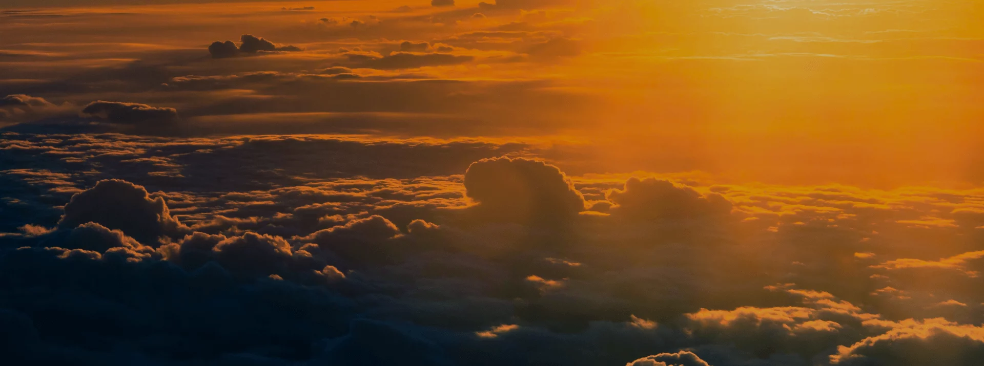 Sunlight over layered clouds, representing scalable cloud testing and automated quality assurance