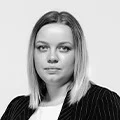 Professional headshot of a woman in business attire for QA services team profile
