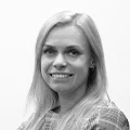 Grayscale headshot of smiling woman, software testing team member
