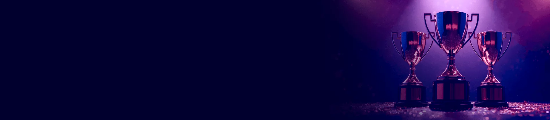Three trophy cups under purple spotlight symbolizing top software testing company recognition